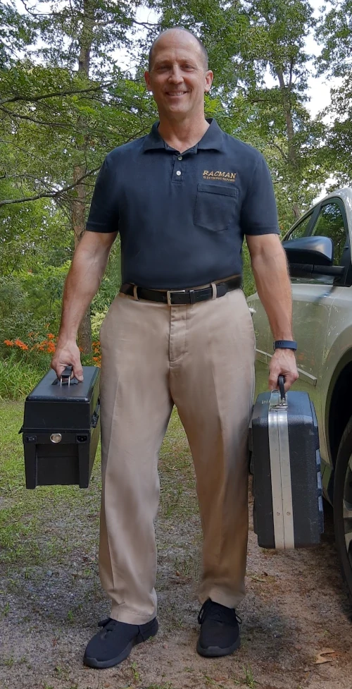 Dave Fusco, standing outside with tools.